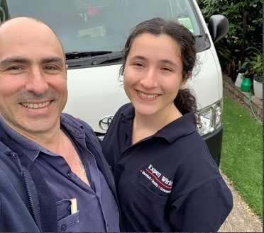 Dave and an Expert Wiring team member in front of an Expert Wiring vehicle